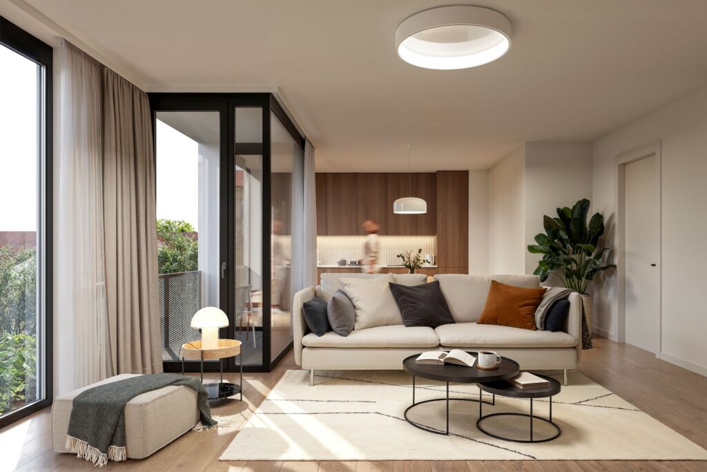 Vzdušný interiér bytů v projektu JITRO – propojení funkčnosti, světla a nadčasového designu s přístupem na balkon do soukromé zeleně.