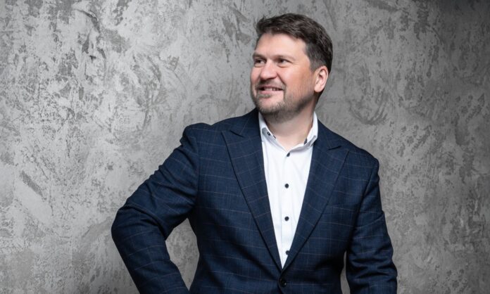 Roman Valný, CEO of Innomotics, photographed against a modern studio backdrop.